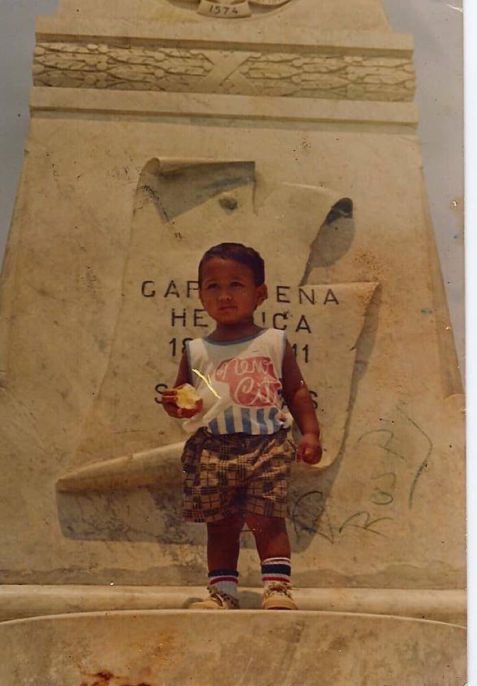 Rafael as a small child, standing at a monument in Cartagena.