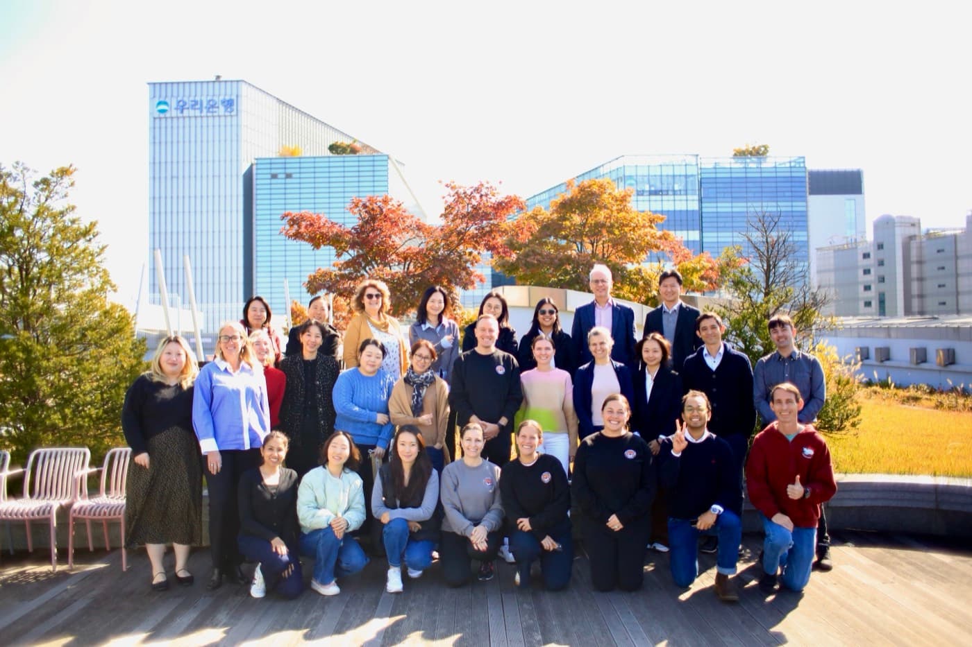 The SENIA Korea job-alike group on a Seoul rooftop in autumn.